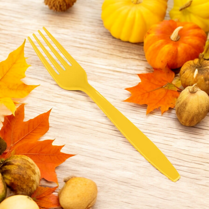 yellow heavy duty plastic fork for yellow themed parties, thanksgiving entertaining, superhero themed parties with bright confetti on wood table