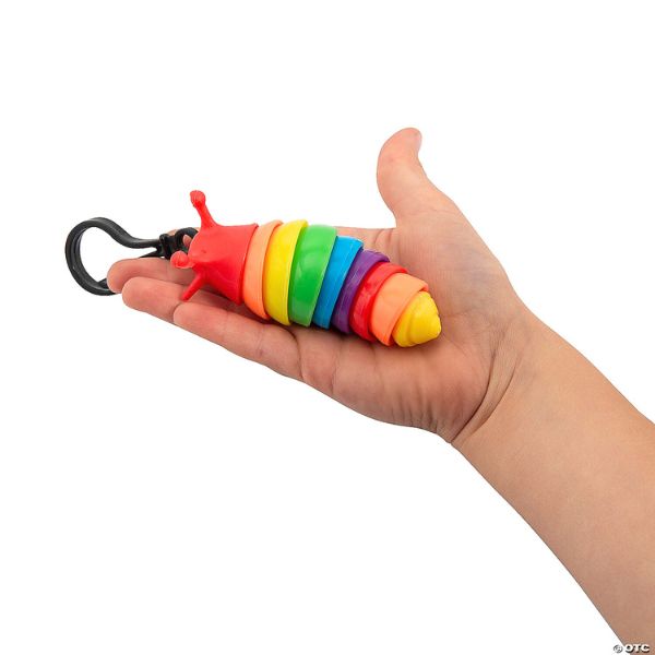 rainbow fidget slug backpack slip sensory toy with read slug head being held in child's hand