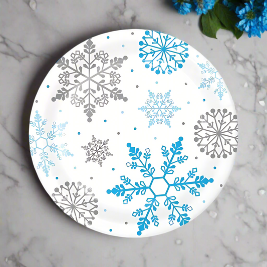 snowflake disposable dinner plates for winter parties, baby showers, snow princess themes, and holiday events with marble background