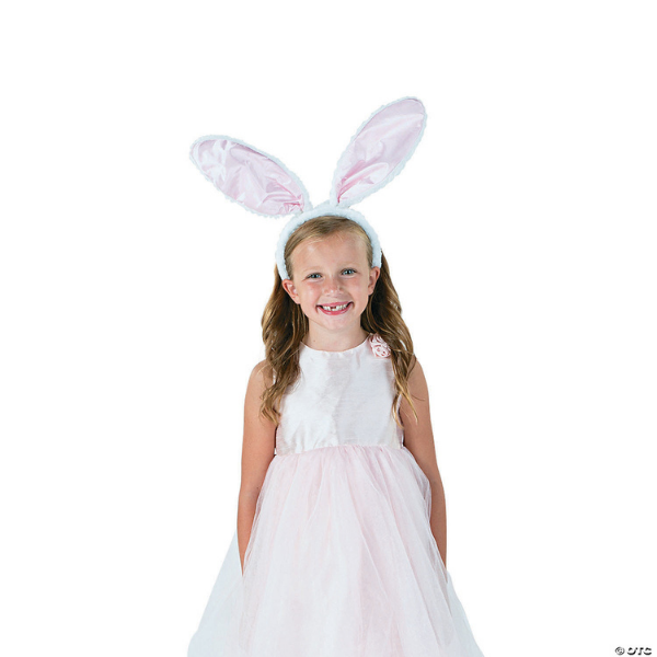 Girl wearing dress and easter bunny ears headband